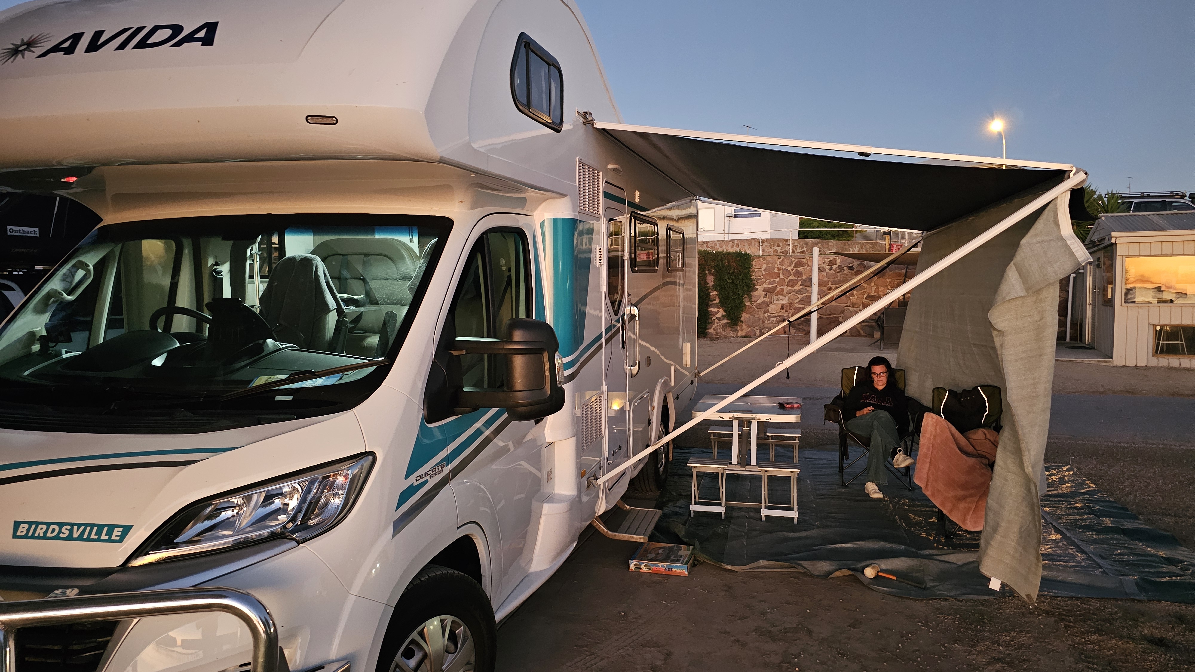 Izzy parked at sunset with the awning out